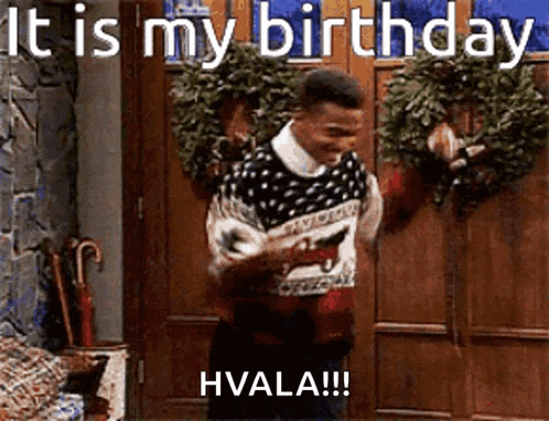 a man in a sweater is standing in front of a door holding a gun and says it is my birthday hvala !!!
