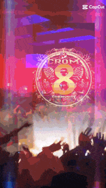 a crowd of people are gathered in front of a sign that says crom community