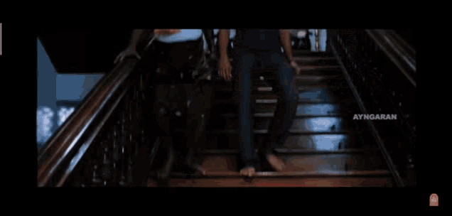 three men are standing on a set of stairs with ayngaran written on the bottom left