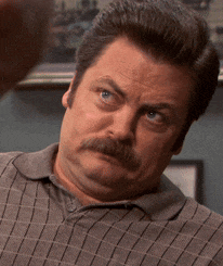 a man with a mustache is making a silly face