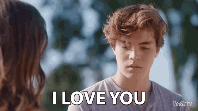 a young man is saying i love you to a woman