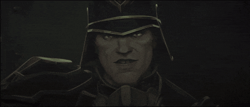 a close up of a man wearing a helmet with a crown on it