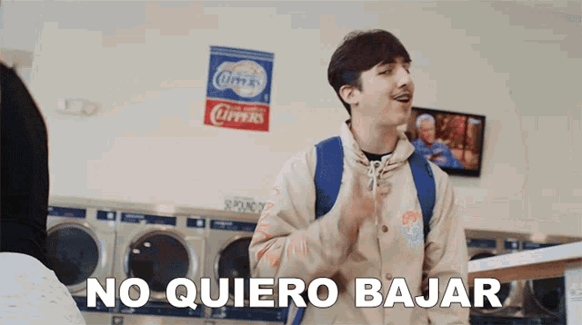 a man in a laundromat says " no quiero bajar " in spanish