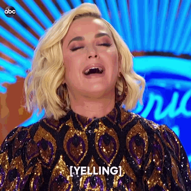 a woman in a sequined dress is yelling at someone