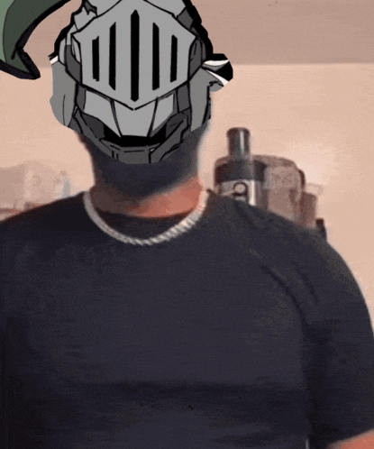 a man wearing a knight 's helmet and a black shirt