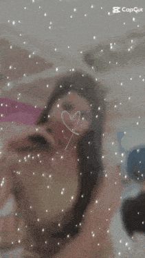 a picture of a girl with a heart drawn on her face