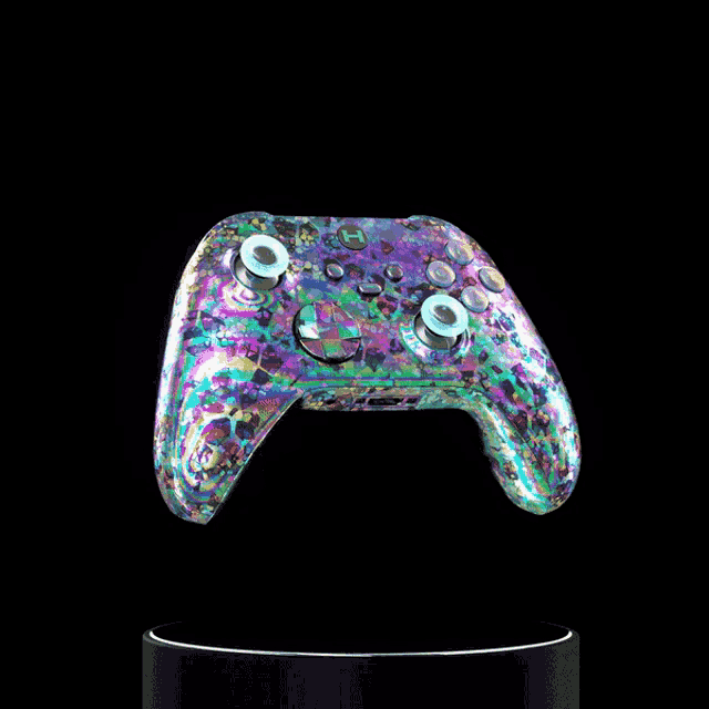 a colorful video game controller with a letter h on it