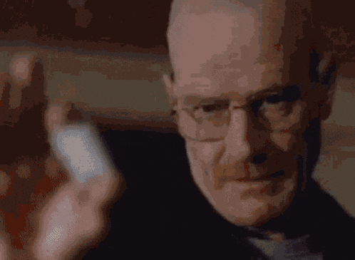 a close up of a man wearing glasses and a black jacket