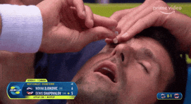 a man laying down with his eyes closed and a screen that says prime video on the bottom