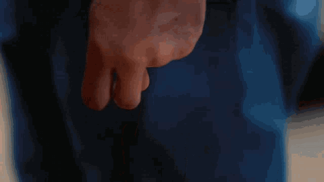 a man and a woman are standing next to each other and looking at each other .