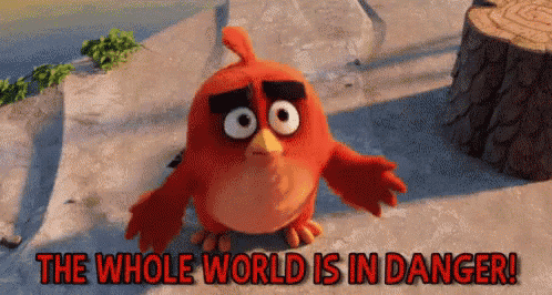a red bird from the angry birds movie is standing next to a tree stump and says the whole world is in danger .