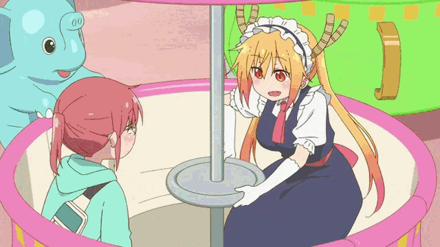 a girl with horns is sitting in a pink carousel