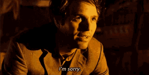 a man in a suit is saying `` i 'm sorry '' .