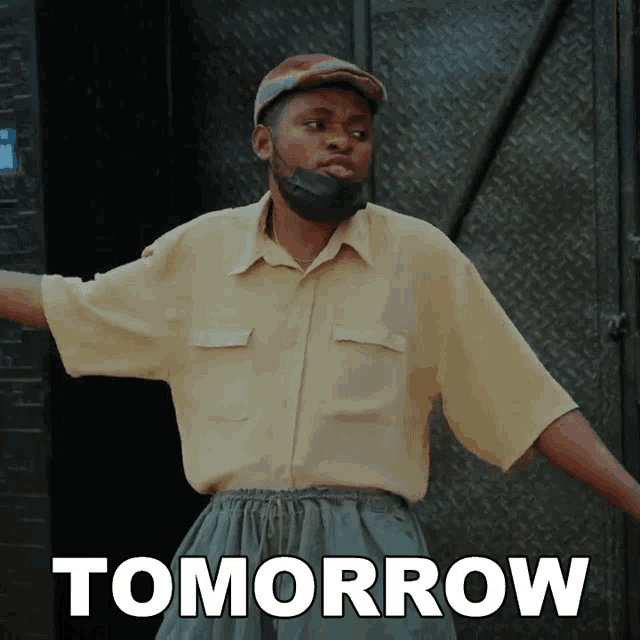 a man wearing a mask stands in front of a tomorrow sign