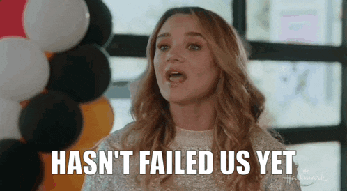 a woman says hasn 't failed us yet with balloons in the background