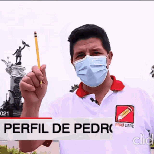 a man wearing a mask is holding a pencil in front of a sign that says perfil de pedro
