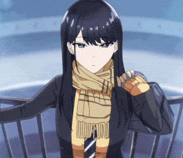a girl with long black hair and a scarf around her neck