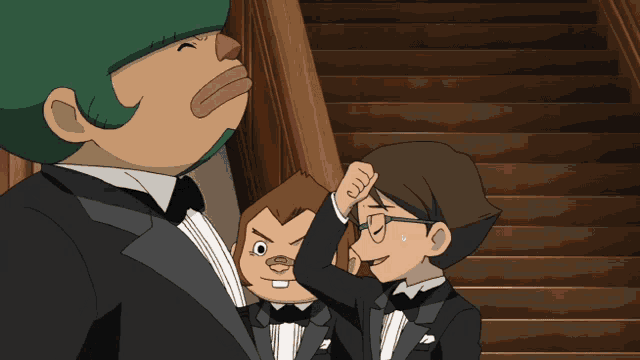 a man in a tuxedo has a bug on his head