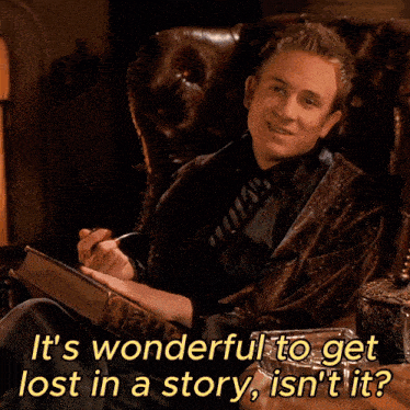 a man sitting in a chair reading a book with the words it 's wonderful to get lost in a story isn 't
