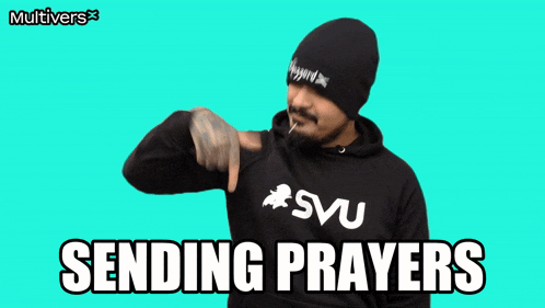 a man wearing a hoodie that says svu is sending prayers