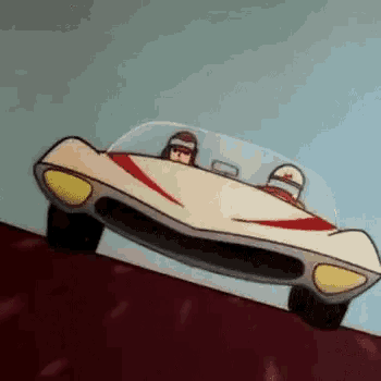 a cartoon car is driving down a hill with two people in it .