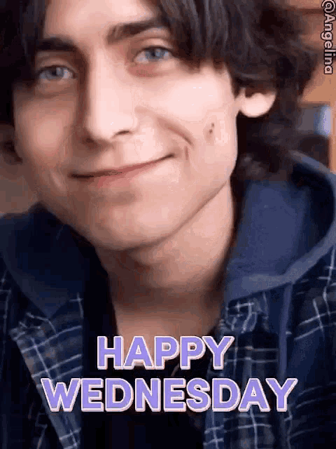 a young man in a plaid shirt is smiling and says happy wednesday .
