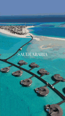an aerial view of saudi arabia with a small island in the background