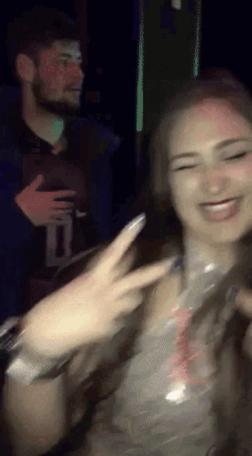 a blurry picture of a man and a woman dancing
