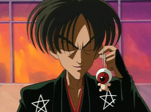 a cartoon character holding a red eye with a star on his chest