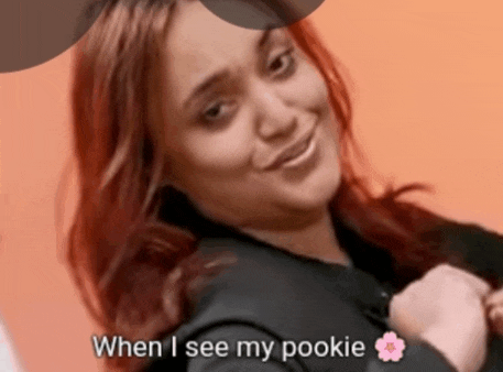 a woman with red hair is smiling with the words when i see my pookie below her
