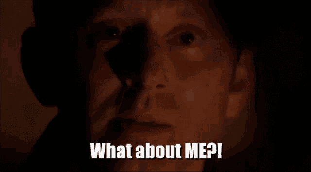 a close up of a man 's face with the words what about me written below him