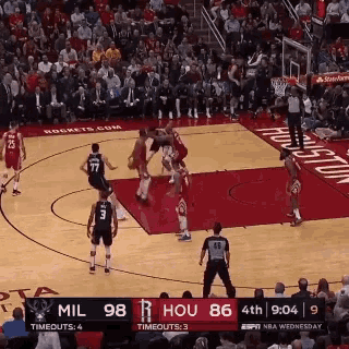 a basketball game is being played between the houston rockets and the milwaukee bucks