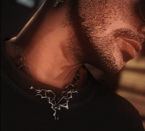 a close up of a man 's neck with a necklace on