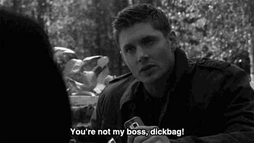 a black and white photo of a man holding a can that says you 're not my boss dickbag