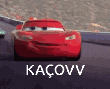 a red lightning mcqueen from cars is driving down a road