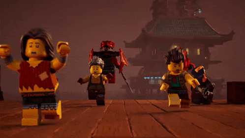 a group of lego figures are standing on a wooden dock