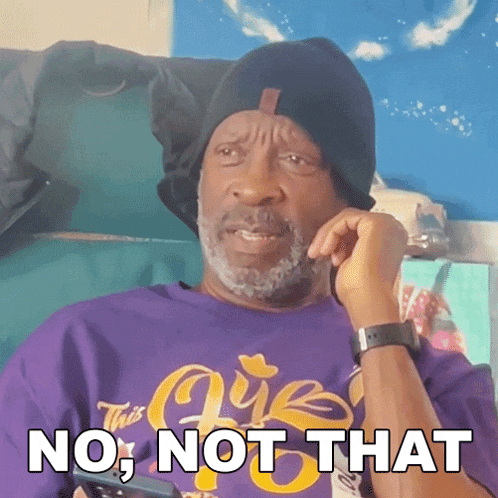a man wearing a purple shirt and a black hat says no , not that