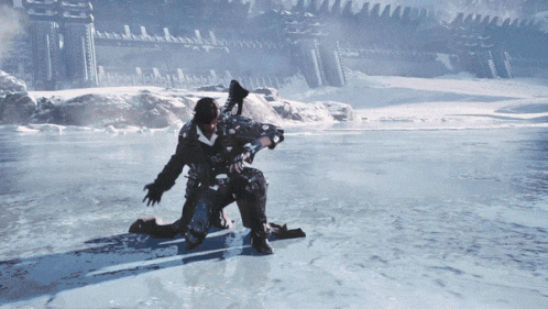 a man is kneeling in the snow with a gun