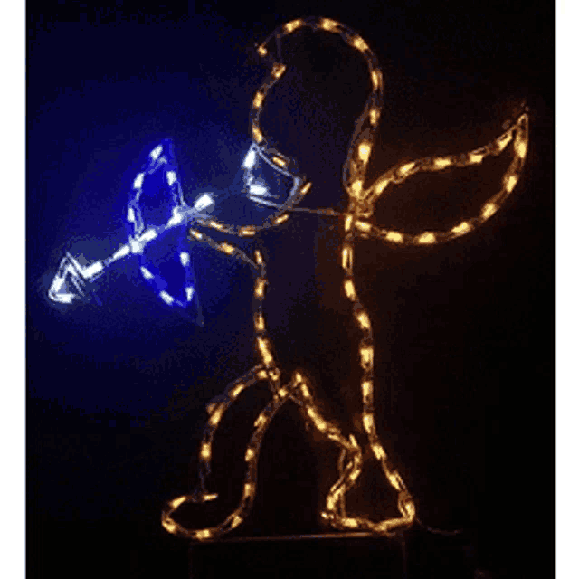 a silhouette of a cupid holding a bow and arrow is lit up with blue and yellow lights