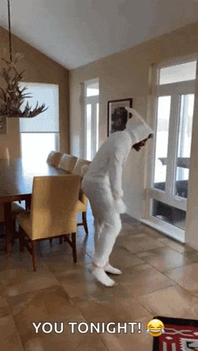 a person in a bunny costume is dancing in a living room with the words " you tonight " written on the bottom
