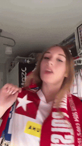 a girl wearing a red and white scarf that says jzow