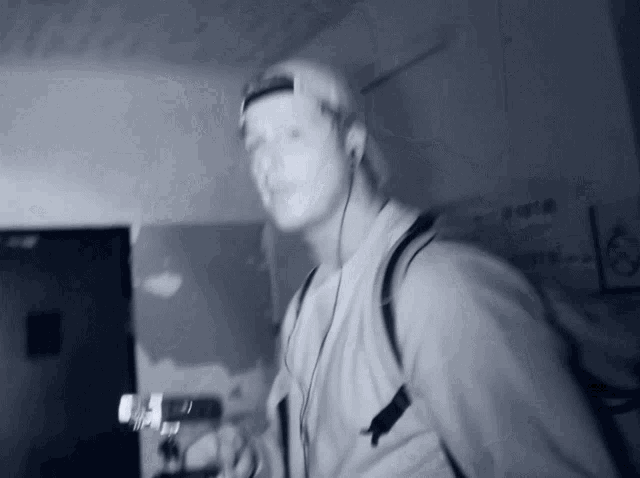 a blurry photo of a man wearing headphones