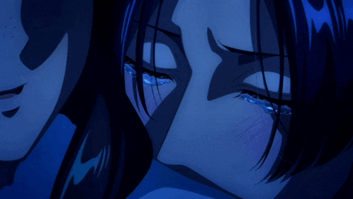 a woman is crying with tears coming down her face