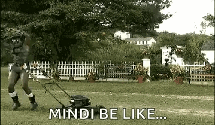 a man is mowing a lawn with a lawn mower and the words `` mindi be like '' .