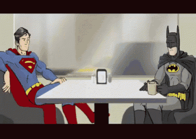 superman and batman sit at a table with cups
