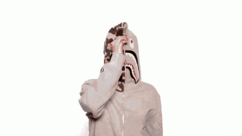 a woman wearing a grey hoodie with the word zip on it