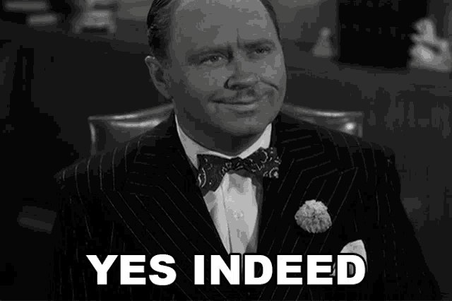 a man in a suit says yes indeed