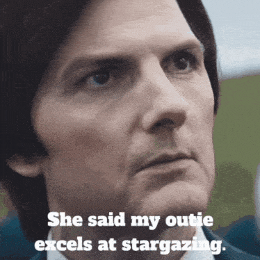 a close up of a man 's face with a caption that says she said my outie excels at stargazing