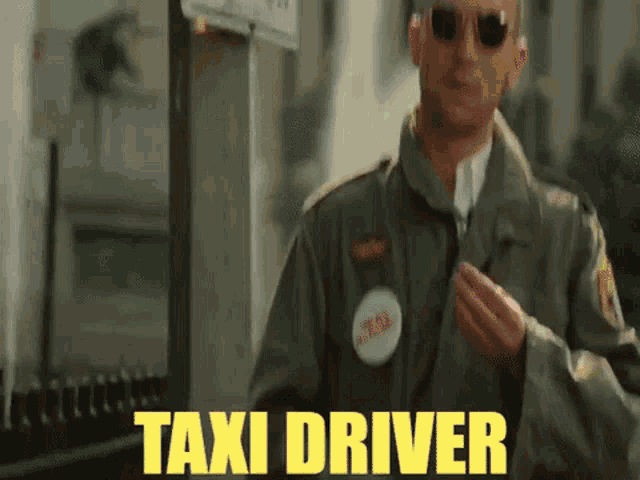 a man in a green jacket and sunglasses is standing in front of a sign that says taxi driver