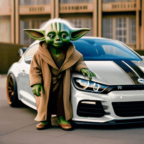 a baby yoda is standing next to a white car with the letter y on the front